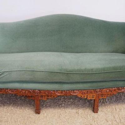 1223	UPHOLSTERED SOFA WITH HEAVILY CARVED WALNUT SKIRT AND ARMS, APPROXIMATELY 84 IN X 32 IN X 45 IN
