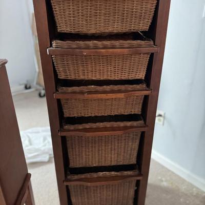 Storage shelf with wicker basket drawers measures 18 x 14 x 48. $40