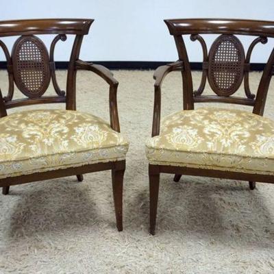 1143	PAIR OF WALNUT UPHOLSTERED ARMCHAIRS W/CANED MEDALION BACK CENTERS
