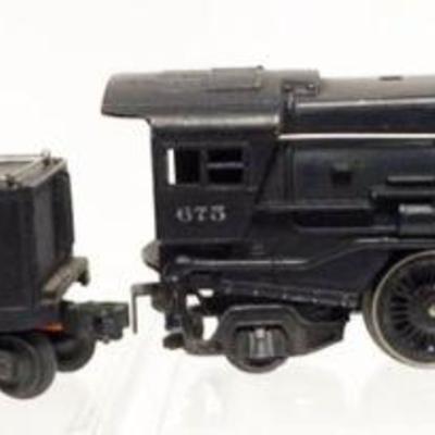1243	LIONEL TRAIN O GAUGE #675 LOCOMOTIVE AND # 2466 WX TENDER
