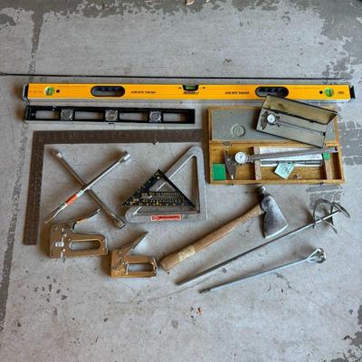 Lot #204 - Two Sets of Dial Calipers, Hatchet, Rafter Square, Lug Wrench, Staple Guns, Levels & More