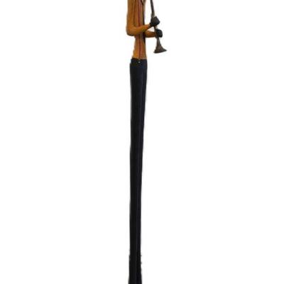 TALL SLENDER JAZZ MUSICIAN PLAYING HORN