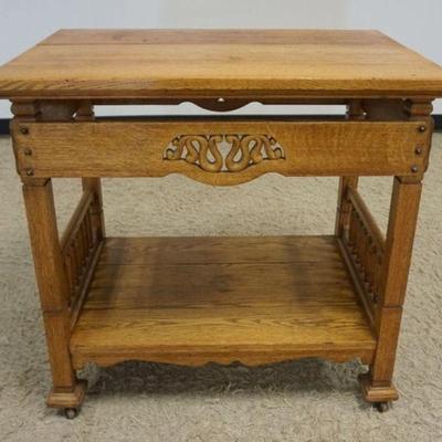 1144	ARTS & CRAFTS OAK LAMP/OCCASIONAL TABLE W/TURNED LOWER GALLERY & ROSETTE ACCENTS, APPROXIMATELY 32 IN X 22 IN X 31 IN HIGH
