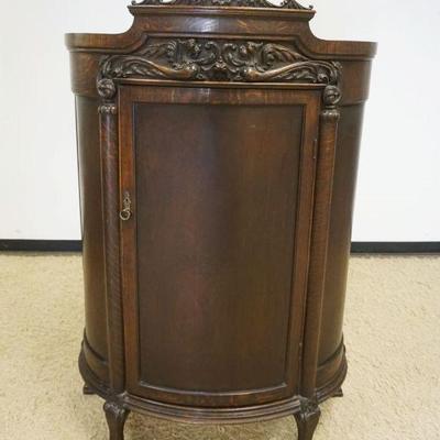 1153	OAK BLIND DOOR HALF ROUND CHINA CABINET W/3 INTERIOR SHELVES, MIRROR BACK & SERPENT CARVED CREST OVER HALF COLUMNS,...