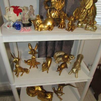 Many pieces of Anthony Freeman Mcfarlin gold leaf ceramic figurines. Several signed.