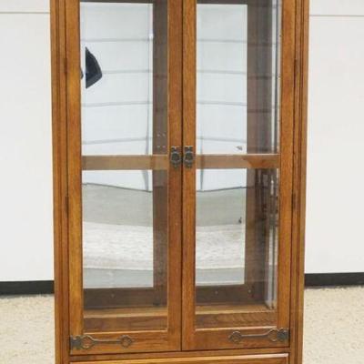 1181	PULASKI OAK 2 DOOR CRYSTAL CABINET WITH LOWER DRAWER AND BEVELED GLASS DOORS WITH SLAG AND ICED GLASS TOP, ADJUSTABLE SHELVES WITH...