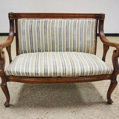 1200	MAHOGANY UPHOLSTERED EMPIRE STYLE SCROLLED ARM LOVE SEAT, APPROXIMATELY 45 IN X 24 IN X 36 IN H, SOME STAINING ON UPHOLSTERY
