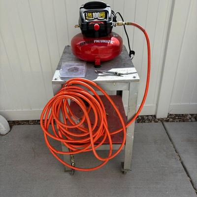 Lot #182 - Central Pneumatic 3 Gallon Oilless Pancake Air Compressor Lot with Hose and Accessories with Cart