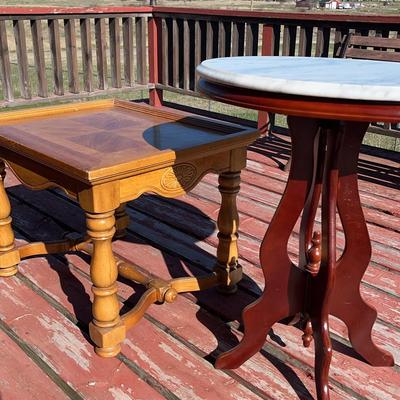 One Short Round Wooden Table And Taller Round table With Non Wood Surface 