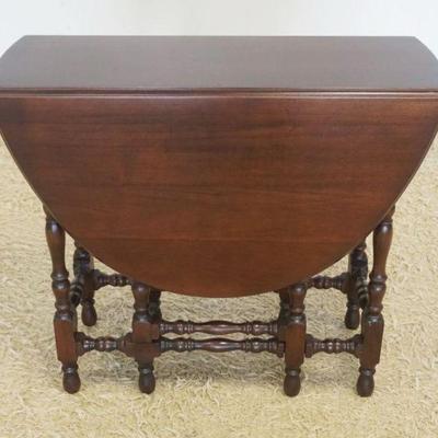 1204	NARROW MAHOGANY OVAL GATE LEG TABLE WITH 1 DRAWER, CLOSED APPROXIMATELY 14 IN X 36 IN X 31 IN H, OPEN APPROXIMATELY 49 IN X 36 IN
