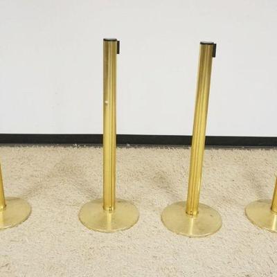1211	GROUP OF 4 BRASS SHEATHED STANCHIONS, EACH APPROXIMATELY 41 IN H X 14 IN ROUND BASE
