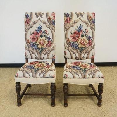 1190	PAIR OF FLORAL UPHOLSTERED HIGH BACK CHAIRS WITH CARVED URN SHAPED FRONT LEGS, EACH APPROXIMATELY 22 IN X 22 IN X 52 IN H

