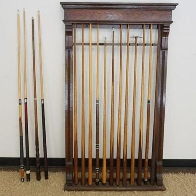 1111	OAK POOL STICK WALL RACK WITH 11 CUE STICKS
