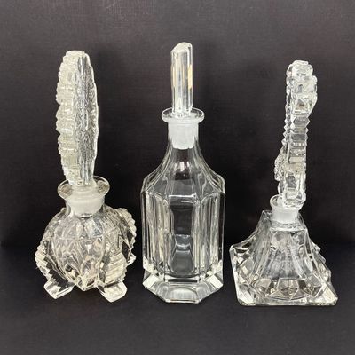LOT 235: Three Stunning Vintage Glass / Crystal Perfume Bottles with Stoppers