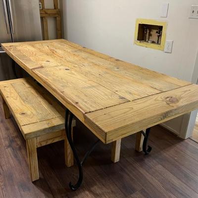 8ft long rustic table with 2 wood benches. Solid oak and wrought iron.  seats 6-8 people.