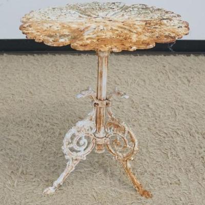 1276	ANTIQUE CAST IRON PATIO TABLE WITH HEART SHAPED GRAPE VINES AND GRAPES, APPROXIMATELY 22 IN X 24 IN H
