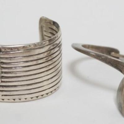 1163	2 BRACELETS, CUFF HAS TOUCH MARKS, KNOT BRACELET MARKED SIGIN TASCO MEXICO STERLING WEIGHING APPROXIMATELY 1.11 TOZ
