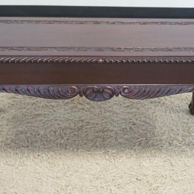 1243	MAHOGANY BALL AND CLAW FOOT LONG STAND WITH CARVED TOP AND SHELL CARVED SKIRT, 1 SIDE DRAWER, APPROXIMATELY 40 IN X 18 IN X 18 IN H
