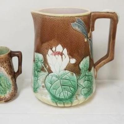1148	4 MAJOLICA PITCHERS, LARGEST APPROXIMATELY 10 IN HIGH
