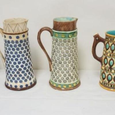 1123	GROUP OF ASSORTED PITCHERS INCLUDING MAJOLICA, ARTHUR WOOD HORSE HEAD HANDLED PITCHER, REDWARE, LARGEST PIECE APPROXIMATELY 8 1/2 IN...