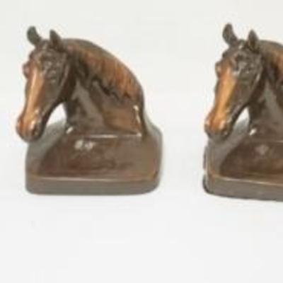 1227	BOOK END SETS INCLUDING METAL CAMEL WITH RIDER, HORSE HEAD IN BRONZE AND SYROCO DOG HEAD, TALLEST APPROXIMATELY 6 IN
