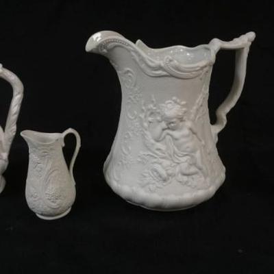 1126	GROUP OF 4 PARIAN PORTMERION PITCHERS, TALLEST APPROXIMATELY 9 IN HIGH
