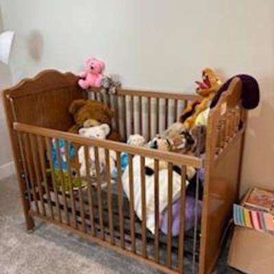 Like new baby crib, and more stuffed animals.