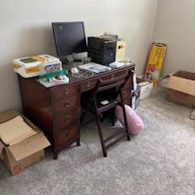 Plenty of office supplies and books.