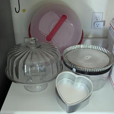 Lot #55 - Bakeware and Storage Lot - Glass Cake Dome, Heart-Shaped Pans, Pampered Chef Flan Pans, Bundt Pan & Cake Storage
