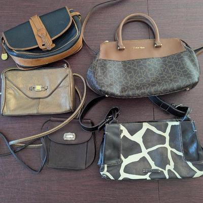 Lot #108 - Trendy Leather Handbags Collection - Including Calvin Klein, Dooney & Bourke, & Fossil