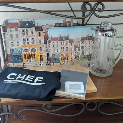 Lot #24 - Chef's Kitchen Essentials Lot - Apron, Cutting Board, Charcuterie Board, Mid Century Gilley Chill-It Pitcher, & Trays