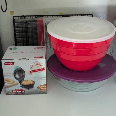 Lot #54 - Kitchenware Auction Lot - Mixing Bowls, Baking Racks and Pie Maker.