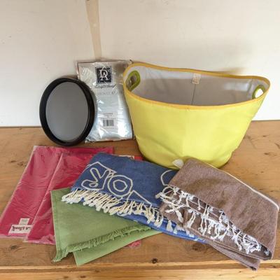 Lot #324 - Soft Sided Ice Bucket, Kitchen Curtains, Table Runners, Towels, a Black and Red Pitcher and a Lazy Susan