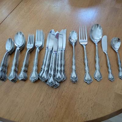Lot #23 - Noritake Sylvia 18-8 Stainless Steel Flatware Set with Serving Utensils