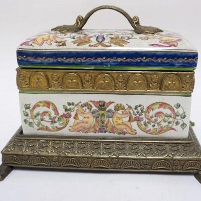 1147	CONTEMPORARY PORCELAIN COVERED BOX IN ORNATE METAL CLAW FOOT BASE, APPROXIMATELY 12 X 8 IN X 9 1/2 IN 
