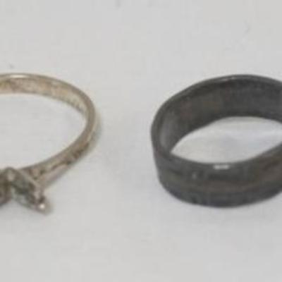 1165	4 LADIES STERLING SILVER RINGS, .69 TOZ
