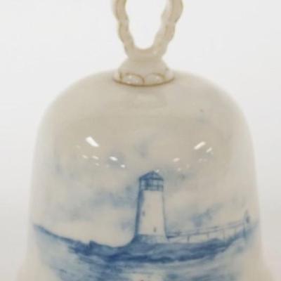 1128	CAC CERAMIC ART CO. BLUE AND WHITE AMERICAN BELLEEK BELL WITH IMAGE OF LIGHT HOUSE, APPROXIMATELY 4 1/4 IN H
