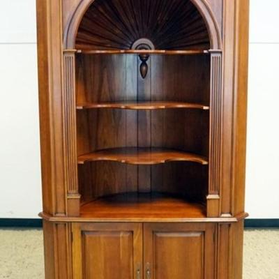 1221	HARDEN CHERRY OPEN FACE CORNER CABINET WITH SCALLOPED EDGE SHELVES AND SHELL CARVED INTERIOR, APPROXIMATELY 25 IN X 47 IN X 88 IN H
