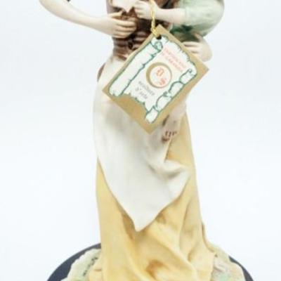 1121	ITALIAN CAPODIMONTE STYLE FIGURE OF WOMAN HOLDING YOUNG BOY, APPROXIMATELY 15 IN H
