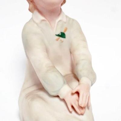 1111	LASZLO ISPANKY FIGURINE OF YOUNG GIRL SITTING, APPROXIMATELY 7 IN H
