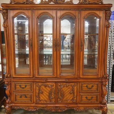 1254	ORNATE FRENCH STYLE 2 PART BEVELED GLASS BREAKFRONT HAVING 6 DOORS, 4 DRAWERS, MIRROR BACK WITH INTERIOR LIGHTS, GLASS SHELVES AND...