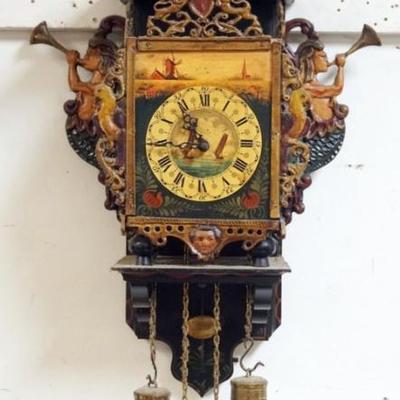 1136	CONTINENTIAL WEIGHT DRVIEN WALL CLOCK WITH PAINT DECORATED METAL FRETWORK, RAMPART LIONS, BIRDS, MERMAIDS, ETC., APPROXIMATELY 12 IN...