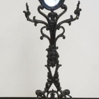 1252	ANTIQUE CAST IRON HALL RACK WITH MIRRORED CENTER AND EMBOSSED FLORAL DESIGN, APPROXIMATELY 27 IN X 11 IN X 73 IN H
