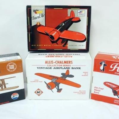1102	4 DIE CAST AIRPLANE COIN BANKS IN ORGINAL BOXES
