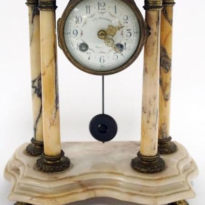 1134	FRENCH MARBLE CLOCK WITH 4 COLUMNS AND PORCELAIN DIAL, BRONZE FERUIS, APPROXIMATELY 10 IN X 5 IN X 12 IN

