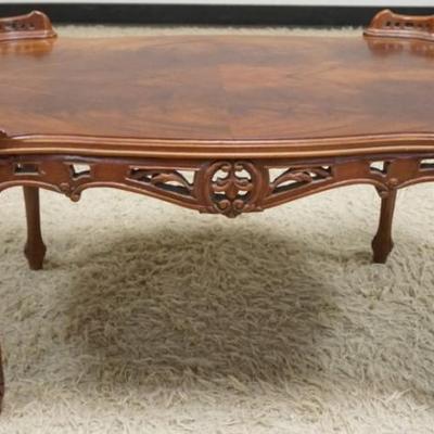 1295	PETITE MAHOGANY COFFEE TABLE WITH PIERCED CARVED WOOD SKIRT AND GALLERY SIDES
