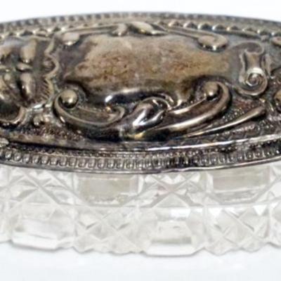 1184	CUT GLASS OVAL BOX WITH SILVER LID, APPROXIMATELY 3 IN X 1 1/2 IN X 1 IN H
