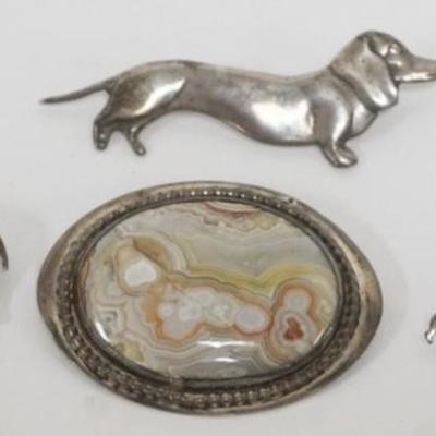 1205	4 STERLING SILVER PINS, 2 DACHSHUND, ELEPHANT WITH ONYX AND QUARTZ PIN HAS CHIP IN STONE, TOTAL WEIGHT 1.26 INCLUDING STONES
