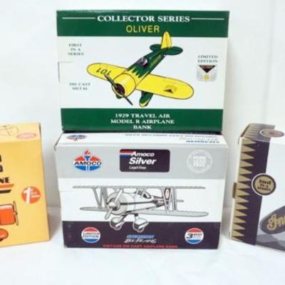 1103	4 DIE CAST AIRPLANE COIN BANKS IN ORGINAL BOXES
