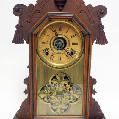 1135	INGRAHAM SHELF CLOCK WITH NICE GILT REVERSE DECORATED GLASS DOOR, APPROXIMATELY 15 IN X 16 IN X 21 IN
